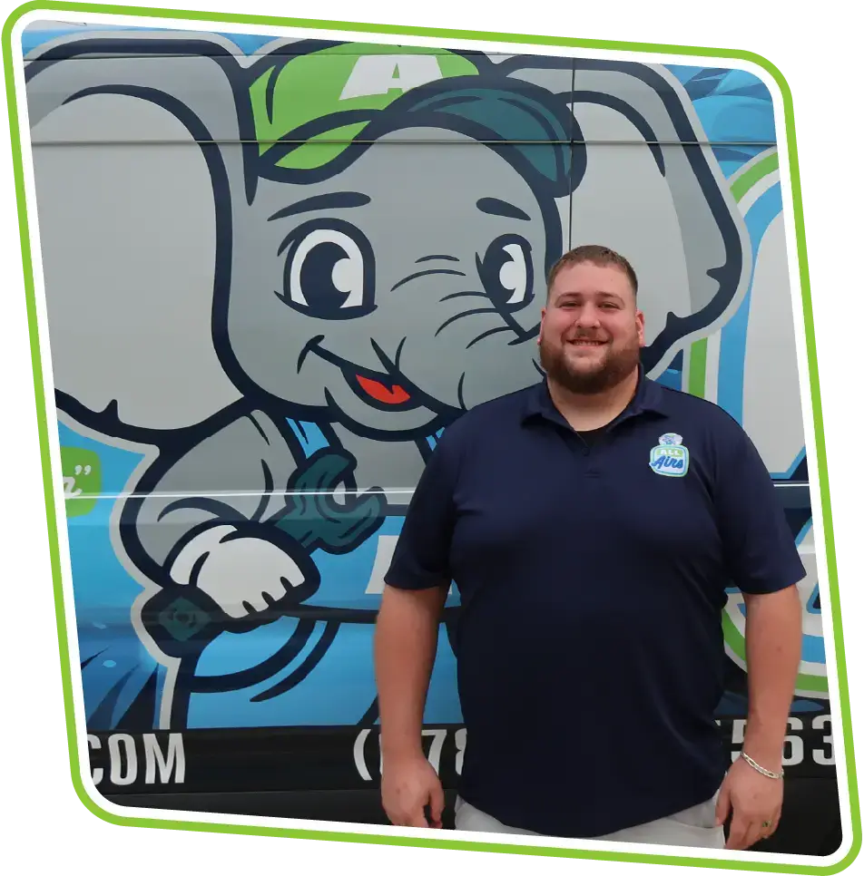 Friendly All Airs Home Services service technician next to company van in Milton, GA.